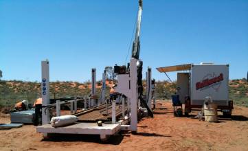 LF90 Diamond Drilling Rig on site, including custom built site office and jack up drill rod carrier.
